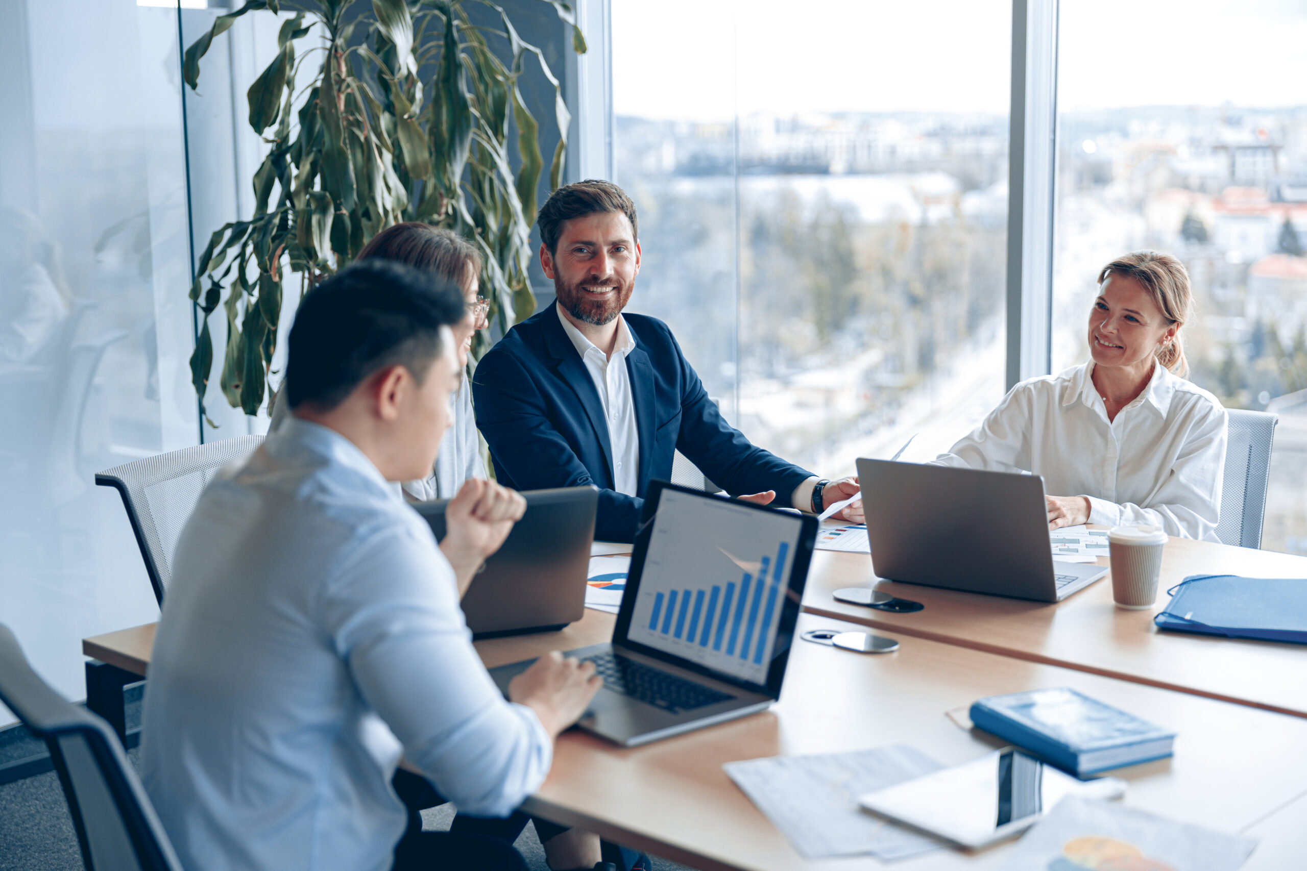 creative business team working on project in modern office with panoramic view